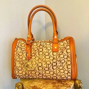 Calvin Klein tan canvas, signature satchel.